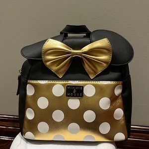 Cute Minnie Mouse gold bag with polka dots.